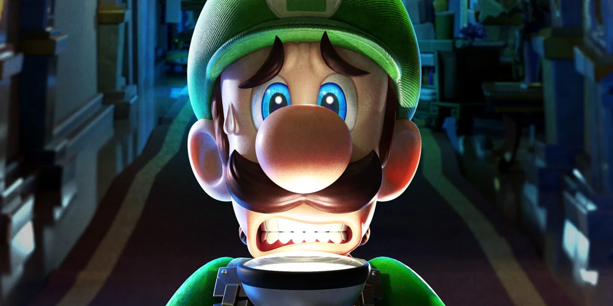 Luigi-looks-scared-as-he-holds-a-torch-up-to-his-face-in-Luigis-Mansion-3