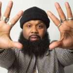 blanco-brown hands outstretached